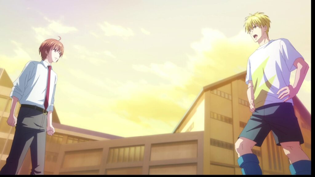 夕焼け空の下、学校の校庭で向かい合う二人のアニメキャラクターの少年。左側にはネクタイを締めた制服姿の茶髪の少年が立ち、右側には星柄のTシャツとハーフパンツ姿の金髪の少年が腰に手を当てて強い口調で話しかけています。
