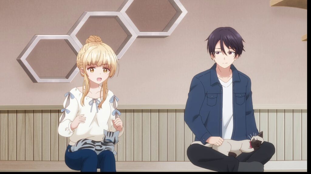 『お隣の天使様』第9話。猫カフェで膝の上に猫を乗せてリラックスする椎名真昼と藤宮周。二人の心の距離が自然と近づくシーン。