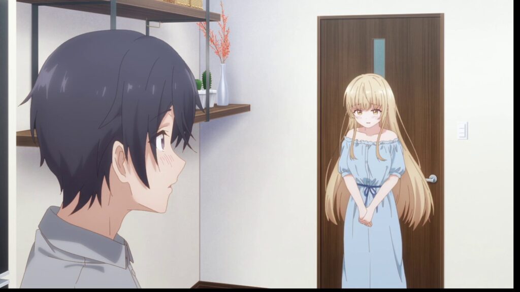 『お隣の天使様』第2期第4話。朝、寝起きで少し恥ずかしそうに立ち尽くす水色のワンピース姿の椎名真昼と、そんな彼女を見つめて頬を染める藤宮周。夜を共に過ごした翌朝の、初々しくも親密な空気感が漂う二人。二人の関係性が新たなステージに達したことを示す、日常の一コマ。